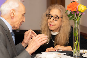 A man and a woman chatting together. Links to Beneficiary Designations A man and a woman chatting together. Links to Beneficiary Designations
